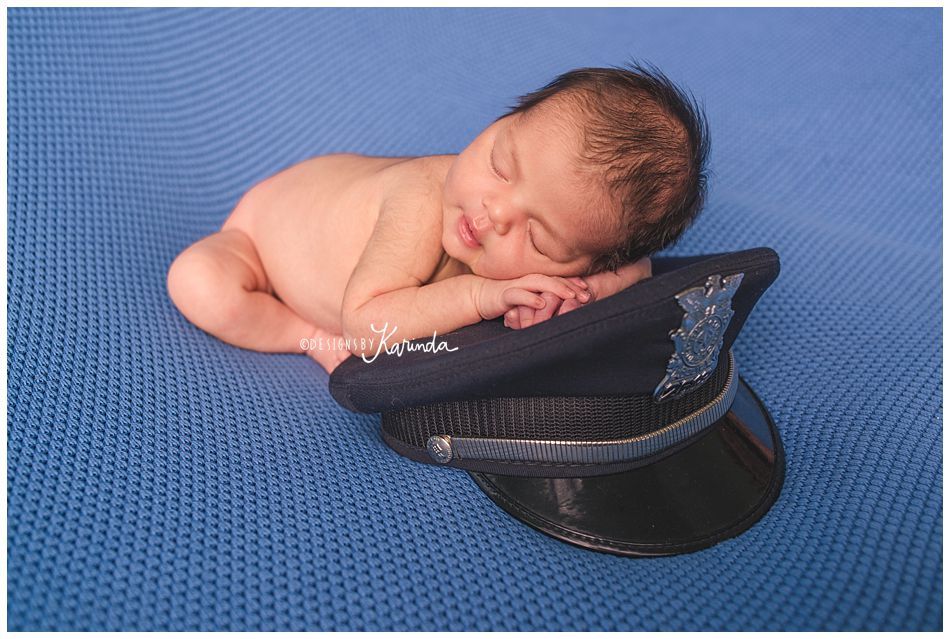 Newborn with police officer hat