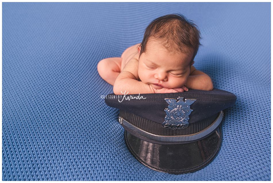 Newborn with police hat
